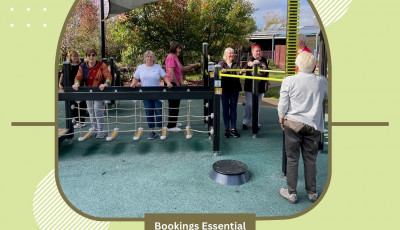 a group of people are standing on some exercise equipment smiling at the camera