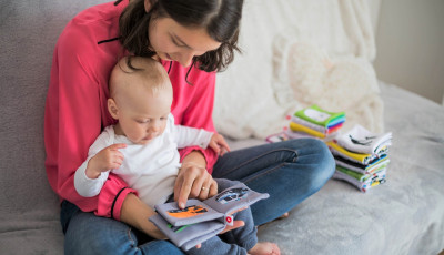 mother reading with baby