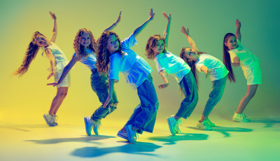 a group of kids are in a dance pose