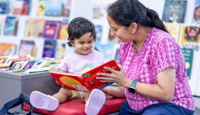 Mother and child reading a story together 