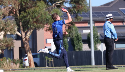 a Teen boys is bowling a cricket ball