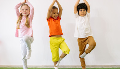 three kids doing yoga