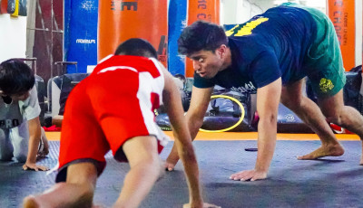 an adult and children are on their hand and feet doing fun exercises together