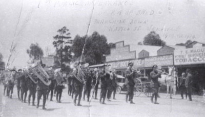 A black and white photograph of the RAAF Band marching down Watton Street, Werribee in 1923.