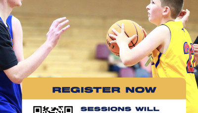 a kid is throwing a basketball to another kid