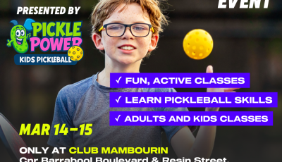 a boy is throwing a yellow ball into the air and smiling at the camers