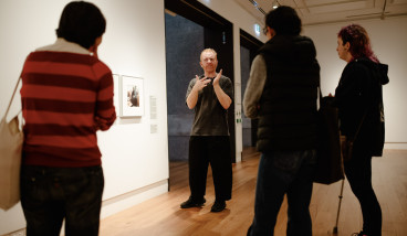 Luke D King provides an exhibition tour in Auslan.